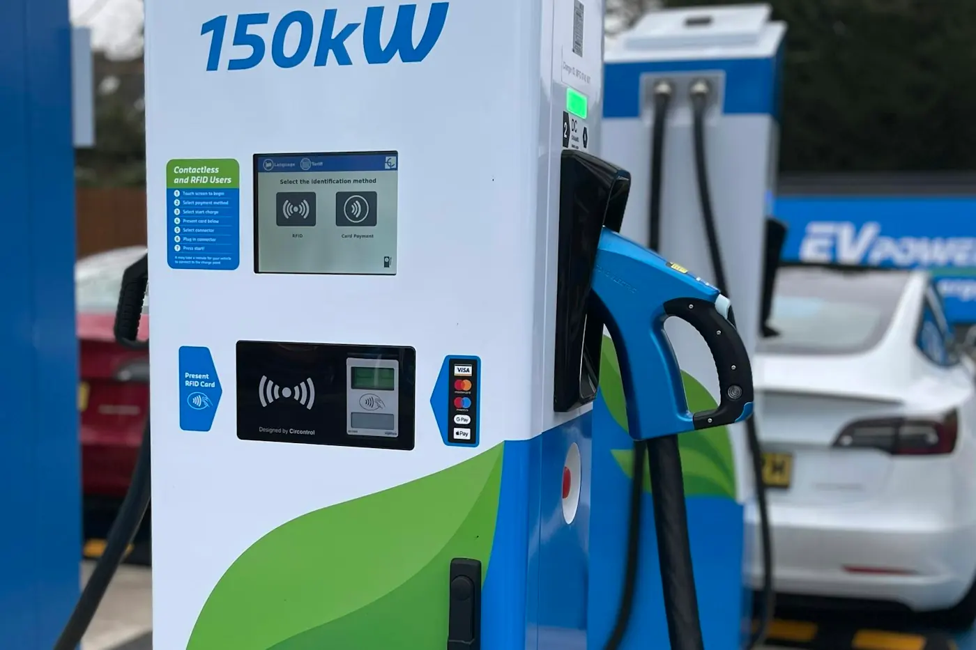 Contactless payment reader and touchscreen on a public fast charger